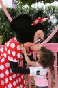Kyra gets a kiss from Minnie